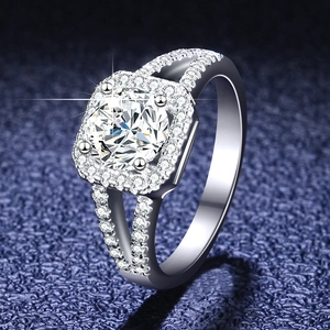 Macro detail of 1-carat moissanite ring with square halo and split shank silver band