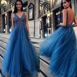 Deep blue sleeveless V-neck sequined evening gown with a flowing split mesh skirt