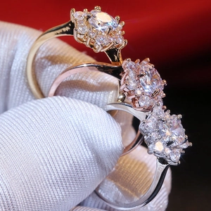 Squisiti anelli girasole in cristallo in oro, oro rosa e argento con petali di zircone