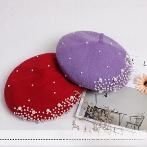 Detail of wool felt berets for girls featuring elegant pearl and rhinestone accents