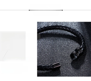 Detailed macro view of 316L stainless steel clasp and black braided leather bracelet