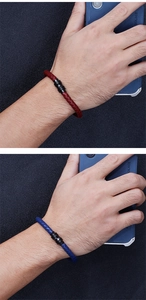 Detail view of woven microfiber leather bracelets in deep red and royal blue with magnetic clasp