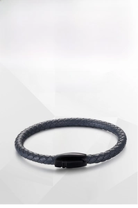 Close-up of navy braided leather bracelet with black titanium steel magnetic clasp