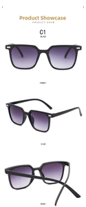 Detail view of black square sunglasses with silver metal rivets and purple gradient lenses