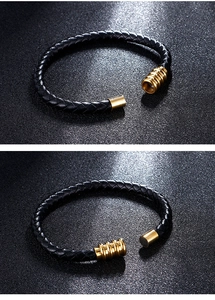 Detailed close-up of a black woven leather bracelet showing the golden magnetic clasp mechanism