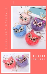 Macro detail of multi-color owl faux fur keychains with gold-tone lobster clasps