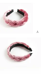 Detail of dusty pink velvet braided headband showing plush texture and weaving craftsmanship