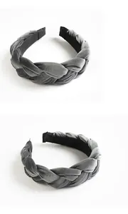 Macro detail of a grey velvet braided headband with soft texture and non-slip lining