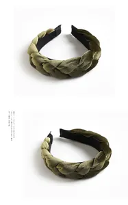 Close-up of dark green braided velvet headband with thick texture and non-slip inner lining