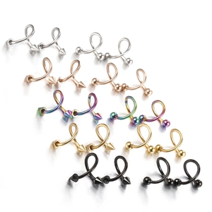 Macro detail of assorted surgical steel spiral piercing rings in five metallic finishes
