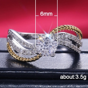 Bague vague bicolore avec zircone 6mm et design croisé serti de cristaux brillants