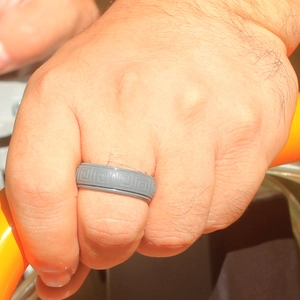 Close-up of grey silicone ring for men featuring a continuous Greek key pattern
