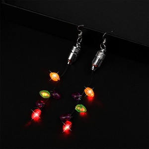Detail of LED Christmas string light earrings featuring glowing red, green, and blue beads