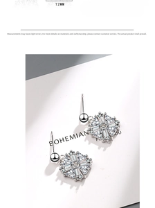 Detail view of 12mm snowflake stud earrings with sparkling zircon stones in silver finish