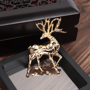 Elegant gold geometric 3D deer brooch pin displayed in a premium jewelry gift box