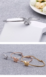 Detail of adjustable butterfly bracelets in gold, silver, and rose gold with rhinestones