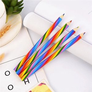 Detailed close-up of rainbow striped wooden pencils with four-color lead on white desk