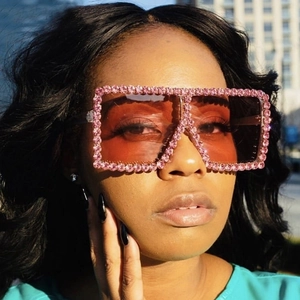 Oversized square sunglasses with pink rhinestones and gradient brown lenses on model