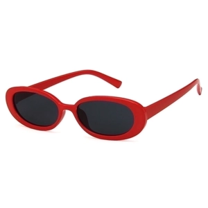 Trendy oval frame sunglasses in bright red with black lenses, vintage Y2K aesthetic