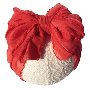Detail of red mesh baby headband with large layered bow and ruffled lace edges