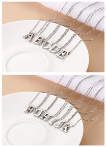 Detail of silver uppercase initial pendants from A to K with pavé zircon setting