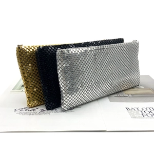 Detailed view of sequined mesh clutch bags in gold, silver, and black for evening parties