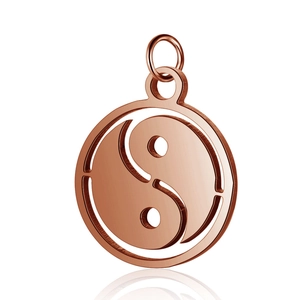 Macro shot of rose gold stainless steel pendant with hollow Tai Chi Yin Yang symbol design