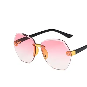 Fashionable rimless polygon kids sunglasses with pink gradient lenses and gold metal bridge