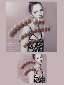 Detail of nude gradient press-on nails with gold foil flakes on a fashion magazine