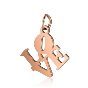 Macro detail of rose gold stainless steel LOVE letter pendant with smooth polished finish