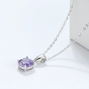 Detail of s925 silver necklace with a four-prong set round purple gemstone and O-chain