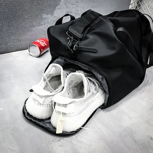 Versatile black travel bag with bottom shoe compartment for fitness and sports gym use