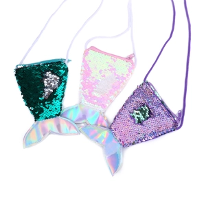 Detailed view of children's sequin mermaid tail cross-body coin purses in green, pink, and purple.