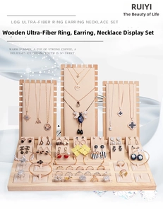 Macro detail of natural wood jewelry display stand with soft beige microfiber lining