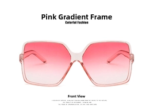 Front view detail of square oversized sunglasses with pink gradient lenses and pink frame