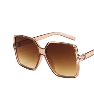 Retro square oversized sunglasses with transparent tea frame and gradient brown lenses