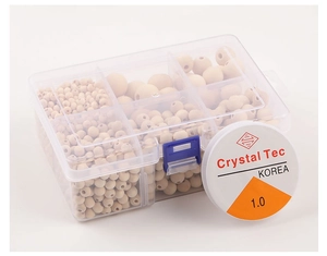 Macro view of natural wood beads set in organizer box with Crystal Tec elastic cord