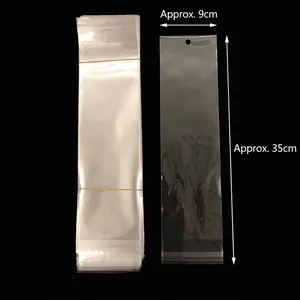 Transparent plastic display bag with hook hole measuring approx 9cm x 35cm for hair clips