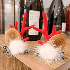 Christmas reindeer antler hair clips with red flocking and white faux fur pom poms