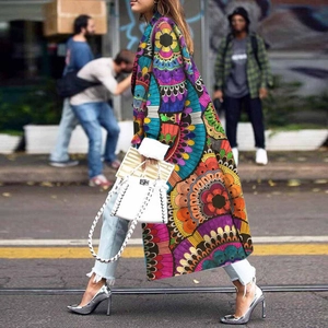 Close-up of colorful kaleidoscope mandala print on women's long wool-like fashion coat