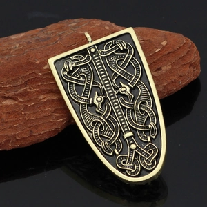 Nordic Viking rune pendant in antique gold finish on a professional black background