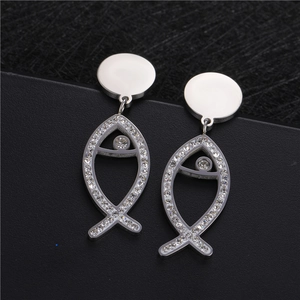 Silver fish earrings with glittering rhinestones on a minimalist stainless steel stud