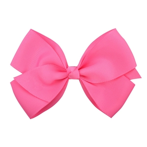 Close-up of bright pink grosgrain ribbon bow clip showing high-quality fabric texture