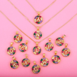 Golden necklace with round pendant featuring multi-color zircon crystals and 26 alphabets