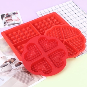 Red 12-cavity silicone waffle molds in rectangular, round and heart shapes for baking