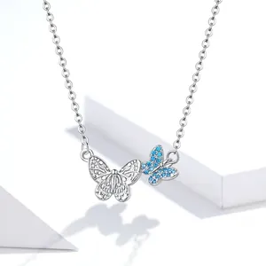Elegant S925 sterling silver bow necklace featuring a blue gemstone butterfly pendant