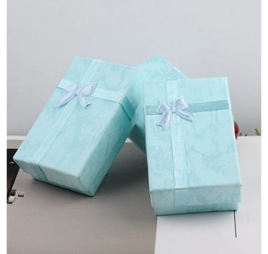 Elegant light blue marble texture gift box with ribbon bow for memorial pendant jewelry