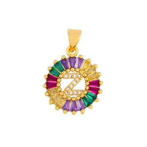 Detailed close-up of gold letter Z round pendant with colorful cubic zirconia inlay