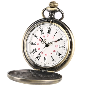 Close-up of vintage bronze pocket watch with open cover and Roman numeral dial details
