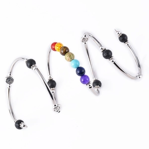 Bohemian spiral bracelet with colorful chakra beads and natural black lava stones